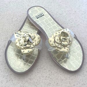 STUART WEITZMAN jelly flip flops w/ gold tone leather flower/rhinestones. 8